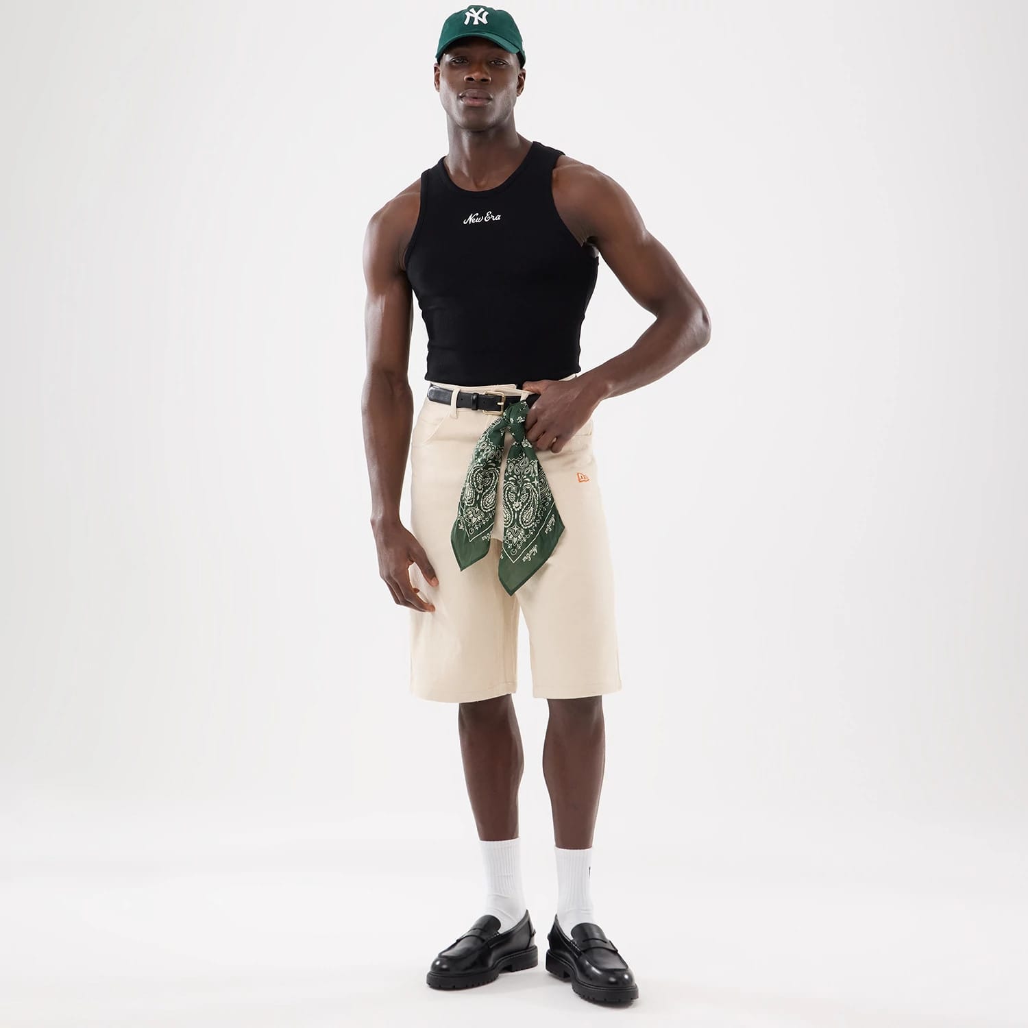 The model is wearing this New Era Rib Vest in black. 16