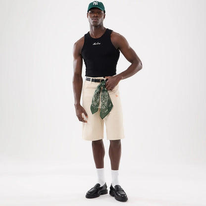 The model is wearing this New Era Rib Vest in black. 16
