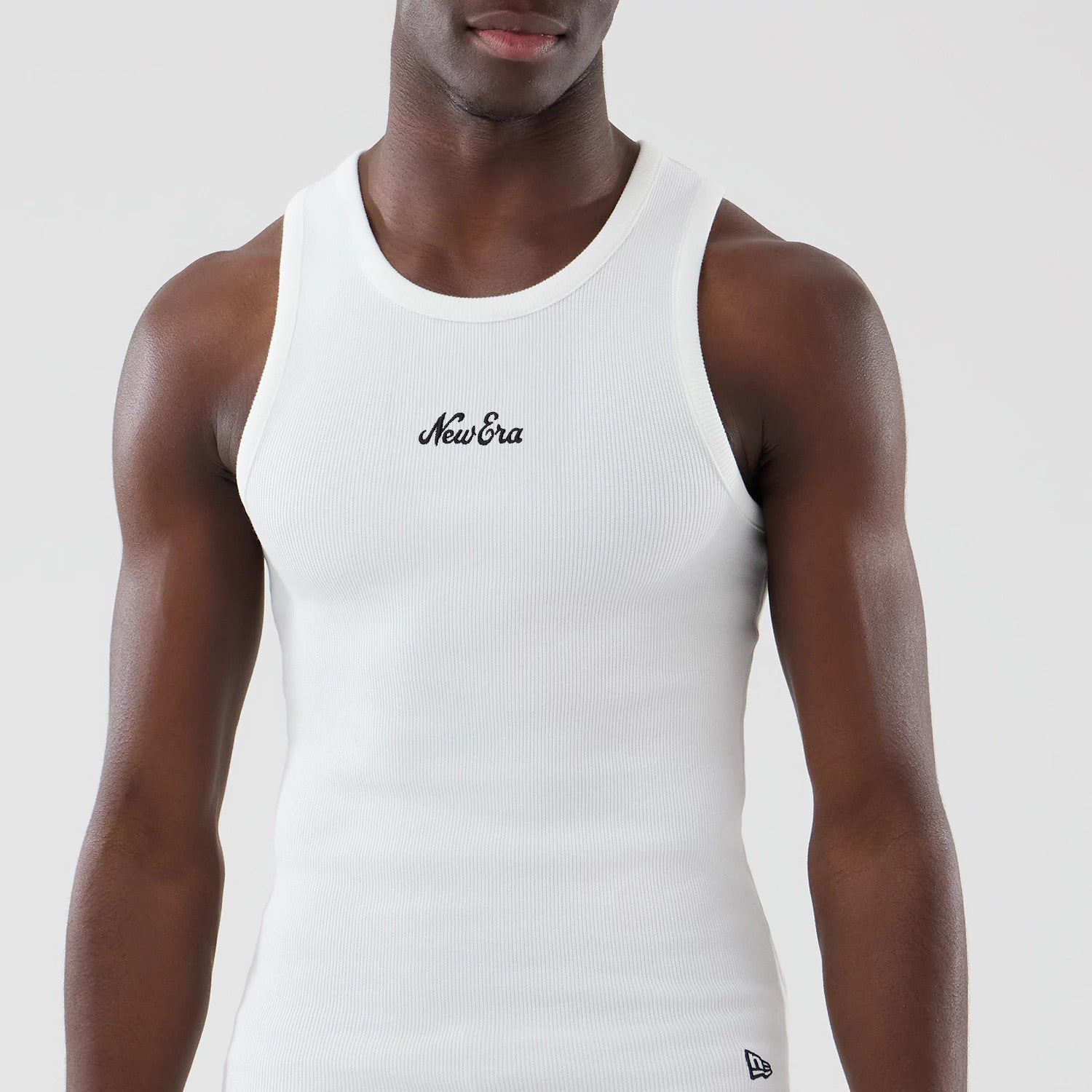 The model is wearing this New Era Rib Vest in white. 3