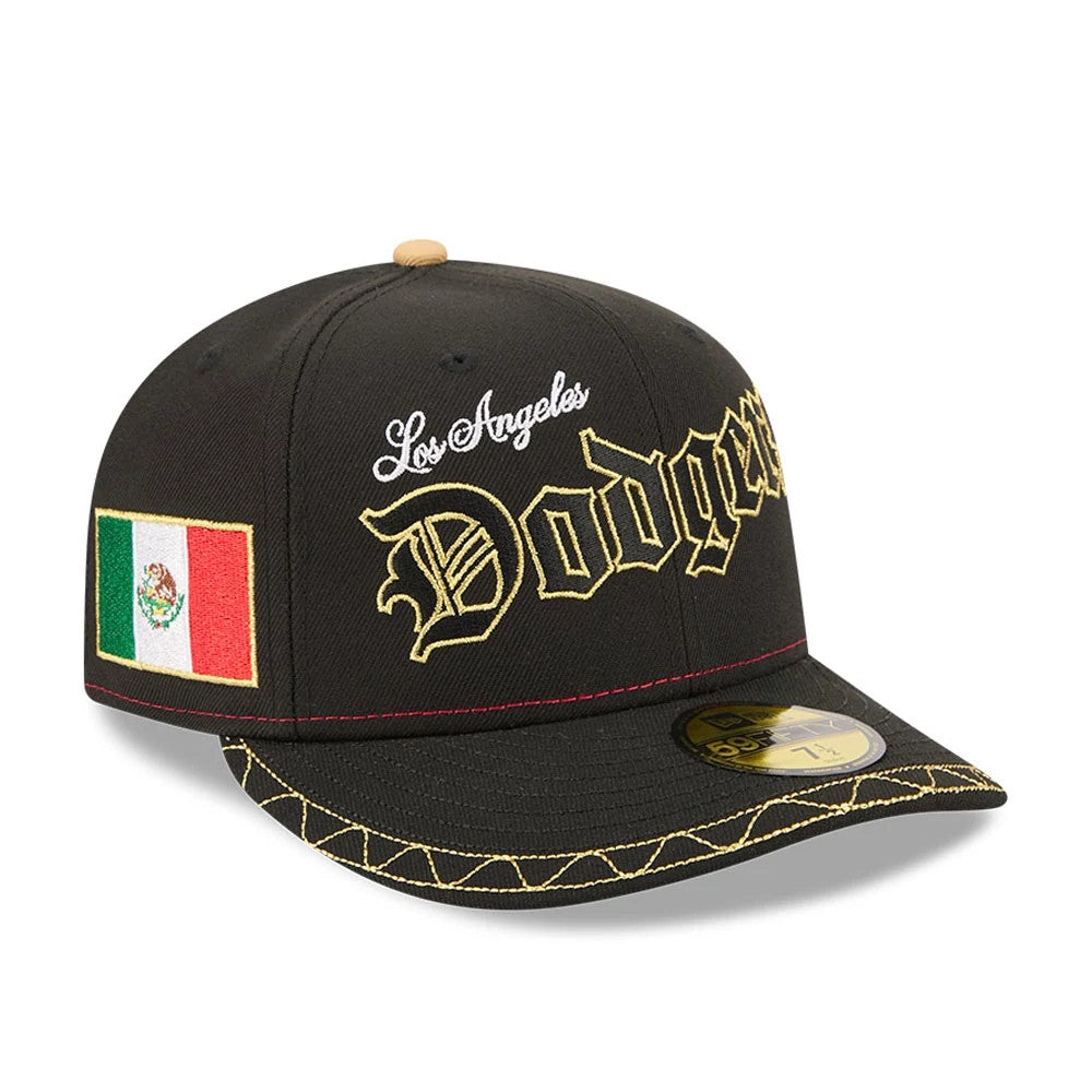LA Dodgers MLB Cinco De Mayo Black New Era 59FIFTY Fitted Cap, three-quarter view showing gold Dodgers script on the front panel, red above the black visor, and a colourful embroidered Mexican flag on the right side.