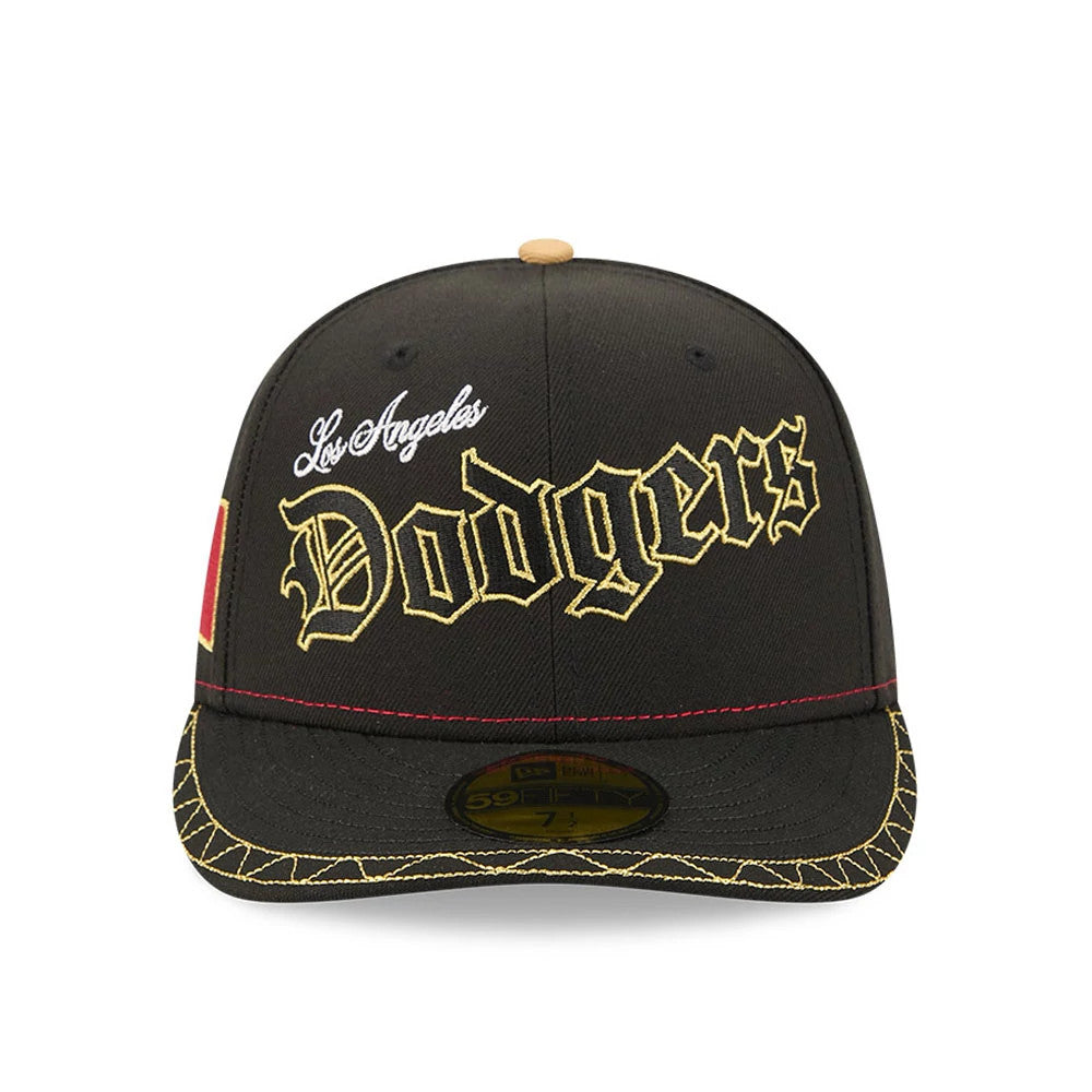 LA Dodgers MLB Cinco De Mayo Black New Era 59FIFTY Fitted Cap, front view showing gold embroidered Dodgers lettering on the crown and a matching decorative pattern on the flat visor, with a gold 59FIFTY size sticker on the visor.