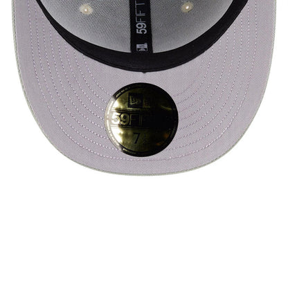 New York Yankees MLB Pastel Green New Era 59FIFTY Fitted Cap, inside view showing the grey undervisor, black inner taping with white 59FIFTY text, and the gold 59FIFTY size sticker prominently displayed on the visor.