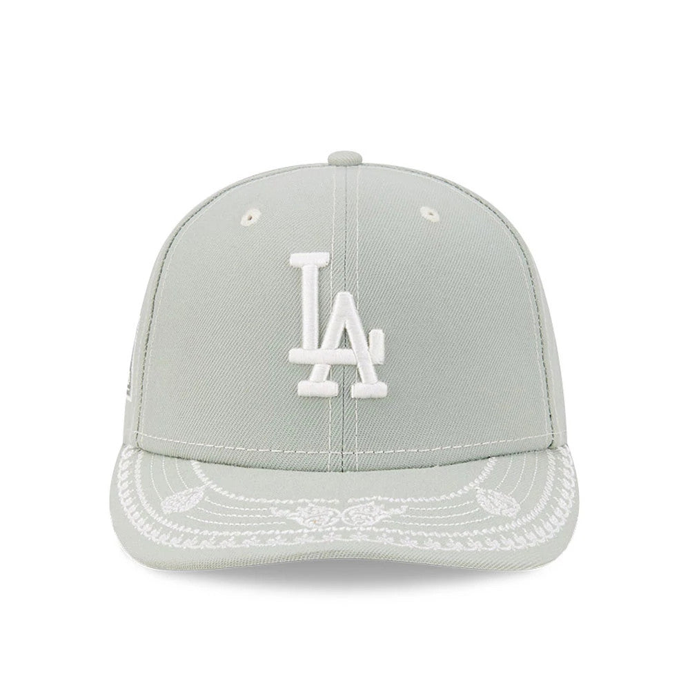 LA Dodgers MLB Pastel Green New Era 59FIFTY Fitted Cap, front view showing a white embroidered LA logo on the crown, intricate white decorative stitching on the pastel green visor, and white eyelets on each panel.