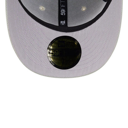 LA Dodgers MLB Pastel Green New Era 59FIFTY Fitted Cap, inside view showing the black printed taping with 59FIFTY branding, a gold 59FIFTY size sticker on the lavender undervisor, and the black sweatband lining the interior.