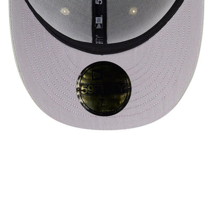 Atlanta Braves MLB Pastel Green New Era 59FIFTY Fitted Cap, inside view showing a black sweatband with New Era branding, grey undervisor with a gold 59FIFTY size sticker at the centre, and black taping with stitching lines.