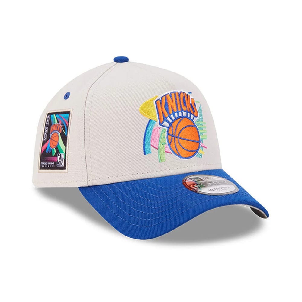 Pictured is this NBA Hardwood Classic New York Knicks 9FORTY A-Frame Adjustable cap in light beige & blue. 1