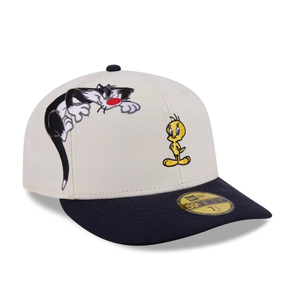 Pictured is this Looney Tunes Pwetty Cat Multi Character 59FIFTY Fitted cap in navy. 1