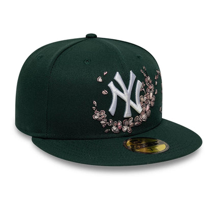 Pictured is this MLB Cherry Blossom New York Yankees 59FIFTY Fitted cap in dark green. 4