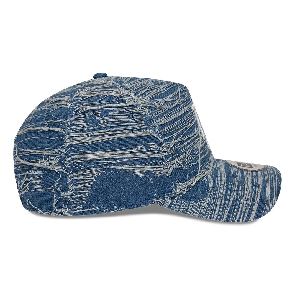 LA Dodgers MLB Distressed Denim Blue New Era 9FORTY E-Frame Adjustable Cap, side view showing a distressed denim texture across the unstructured blue crown and curved visor, with a 9FORTY size sticker on the visor and one blue embroidered eyelet.