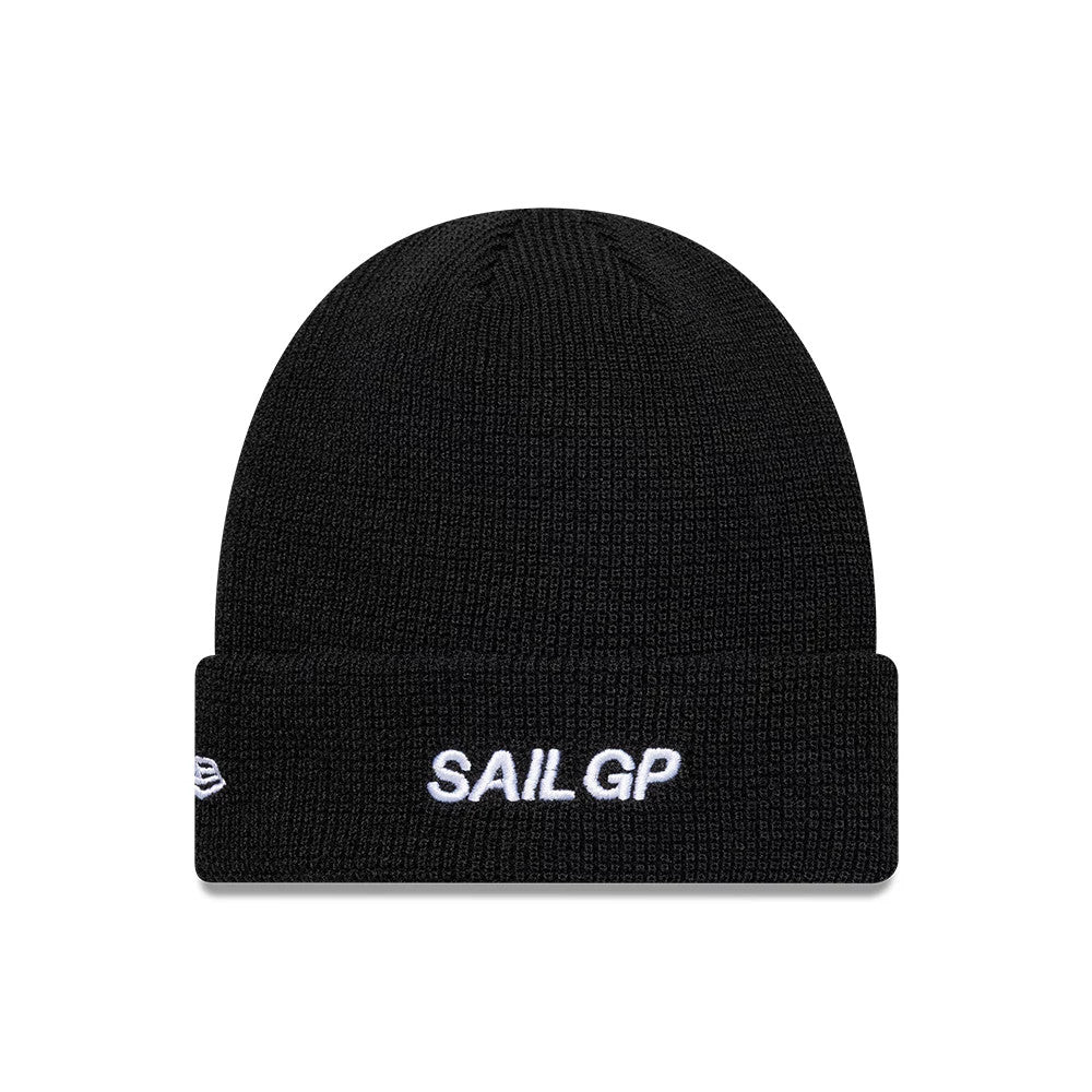 New Era Sail GP Waffle Black Cuff Knit Beanie, front view showing white embroidered Sail GP lettering on the cuff, with a textured waffle knit pattern and the New Era flag logo on the side.