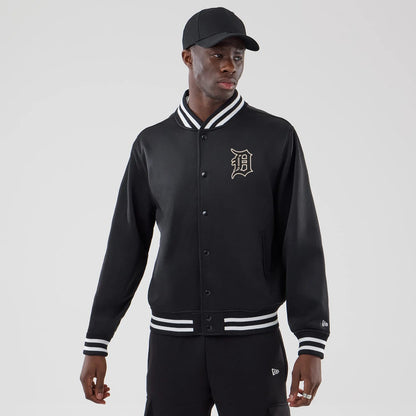 The model is wearing this MLB Jersey Bomber Detroit Tigers Jacket in black. 1