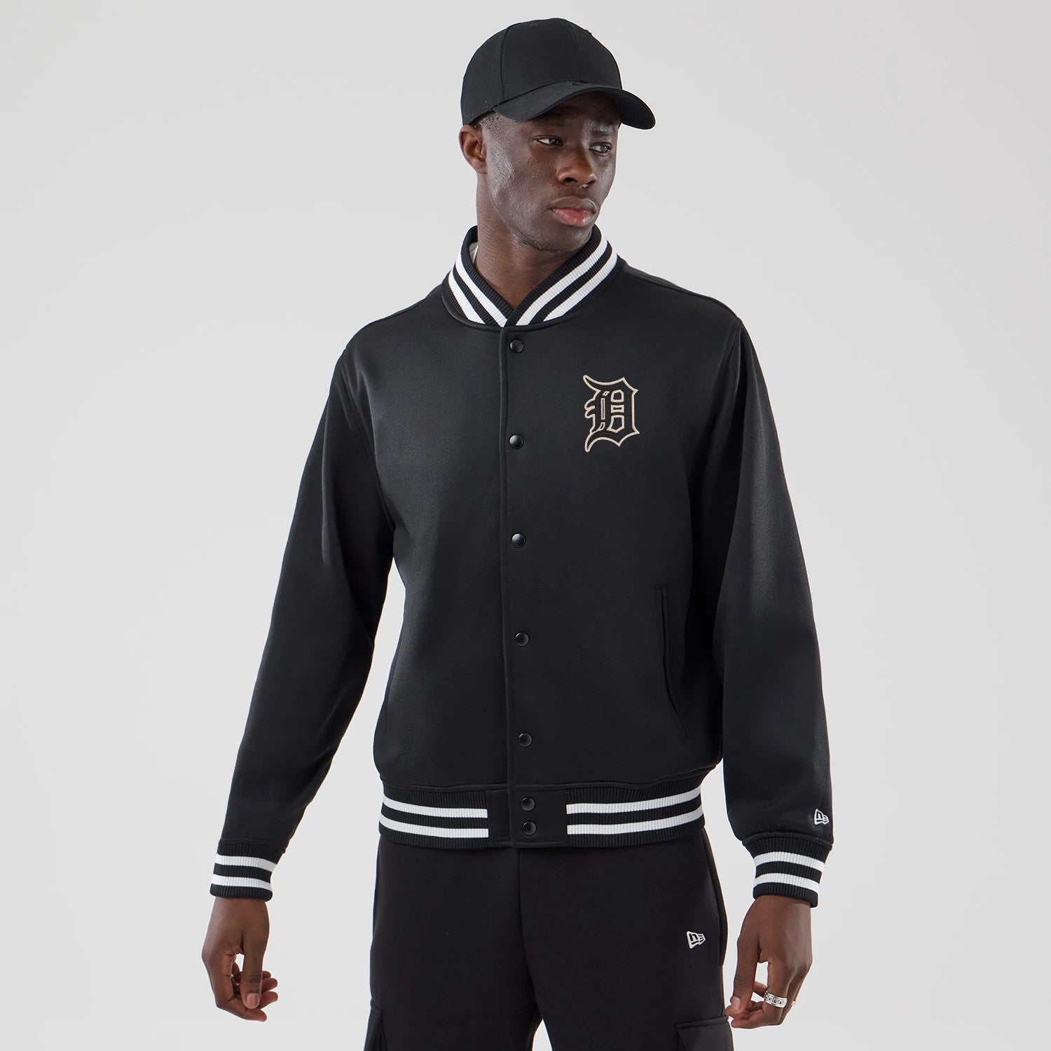 The model is wearing this MLB Jersey Bomber Detroit Tigers Jacket in black. 1