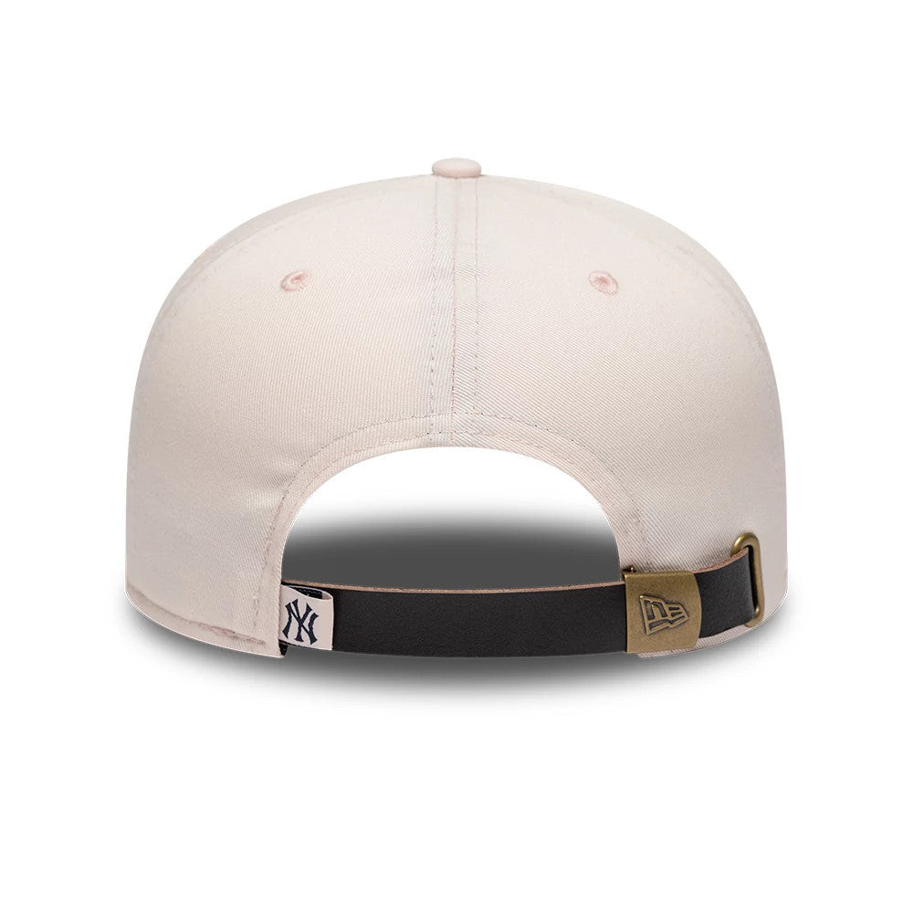 New York Yankees MLB Flower Pastel Pink New Era 19TWENTY Adjustable Cap, rear view showing the black adjustable strap with a brass buckle featuring the New Era flag logo, and a small NY Yankees logo on the fabric loop.
