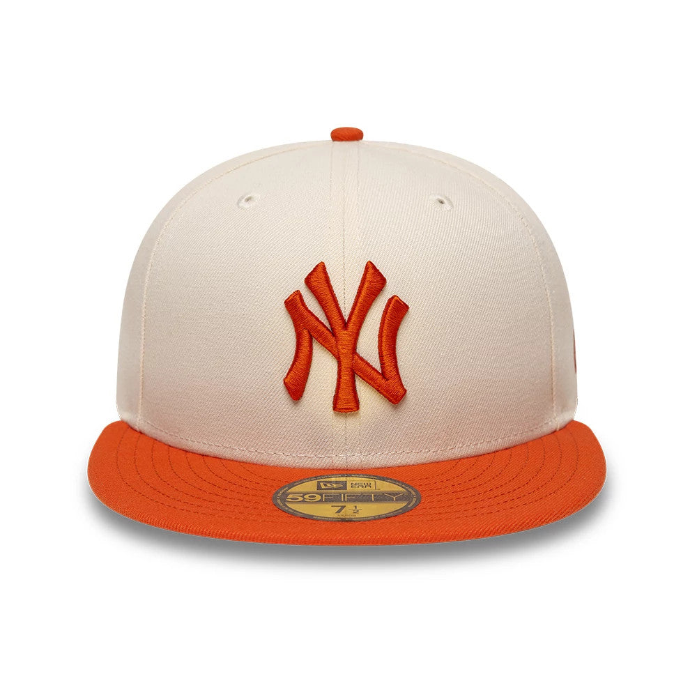 New York Yankees MLB League Essential Cream & Orange New Era 59FIFTY Fitted Cap, front view showing the raised orange NY logo embroidered on the cream front panel, paired with an orange flat visor and a gold 59FIFTY size sticker.