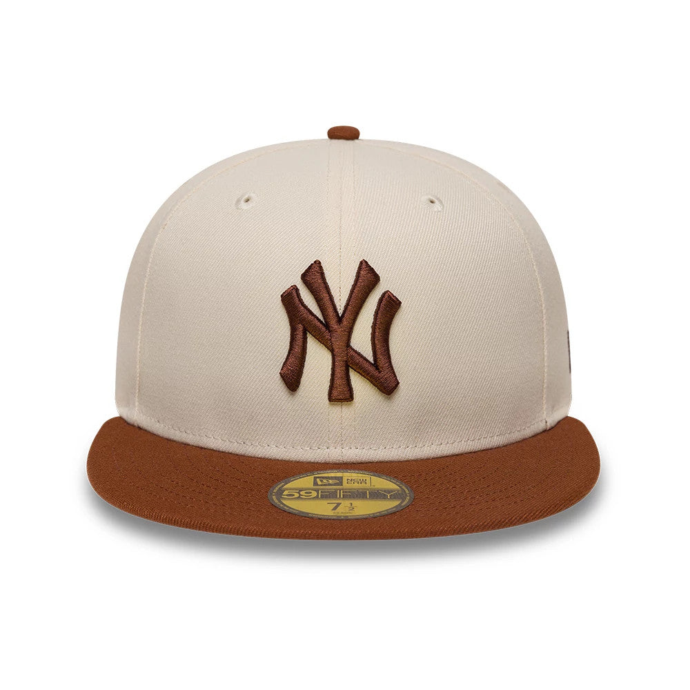 Pictured is this MLB League Essential New York Yankees 59FIFTY Fitted cap in cream. 2
