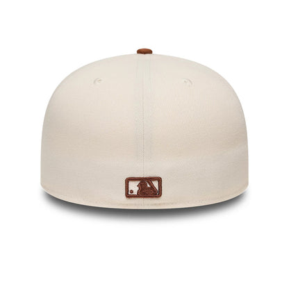 Pictured is this MLB League Essential New York Yankees 59FIFTY Fitted cap in cream. 4