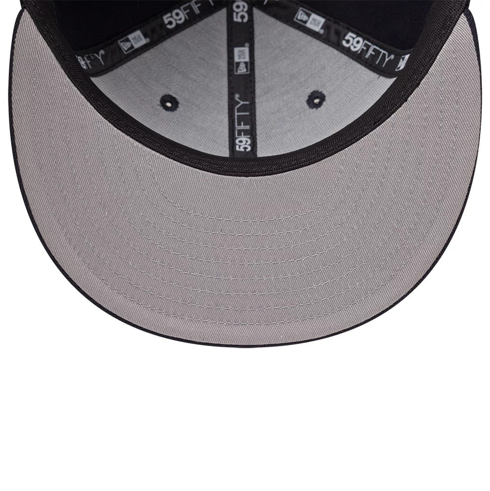 New York Yankees MLB Emblem Navy New Era 59FIFTY Fitted Cap, inside view showing the grey undervisor, black sweatband, and branded taping with New Era and 59FIFTY logos, along with black embroidered eyelets on the structured crown.
