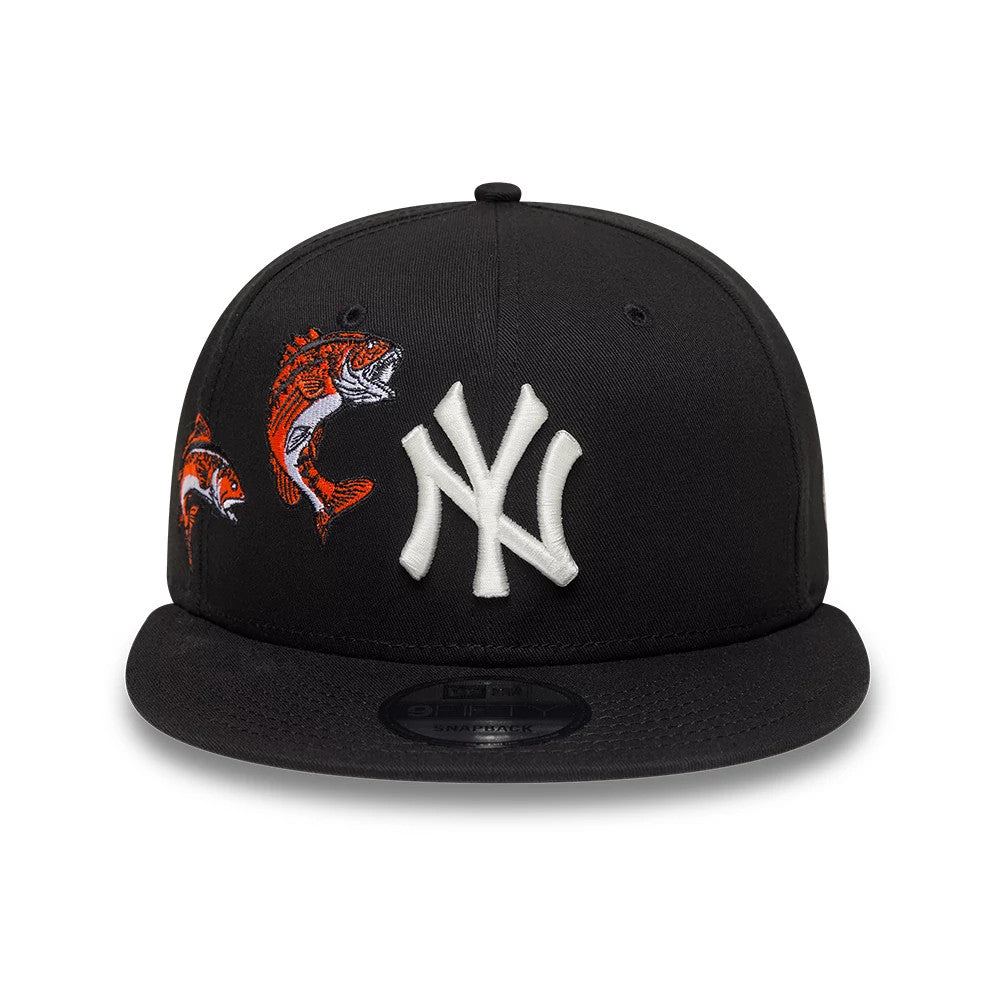 New York Yankees MLB Outdoor Icon Black New Era 9FIFTY Snapback Adjustable Cap, front view showing the raised white embroidered NY logo on the structured black crown, alongside orange fish graphics and the 9FIFTY size sticker on the visor.