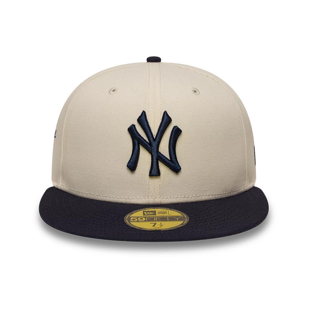 Pictured is this MLB Side Script New York Yankees 59FIFTY Fitted cap in cream & navy. 2