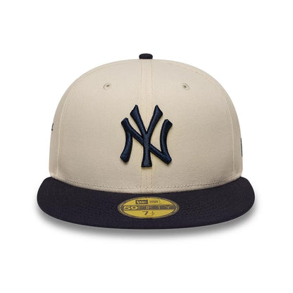 Pictured is this MLB Side Script New York Yankees 59FIFTY Fitted cap in Cream. 2