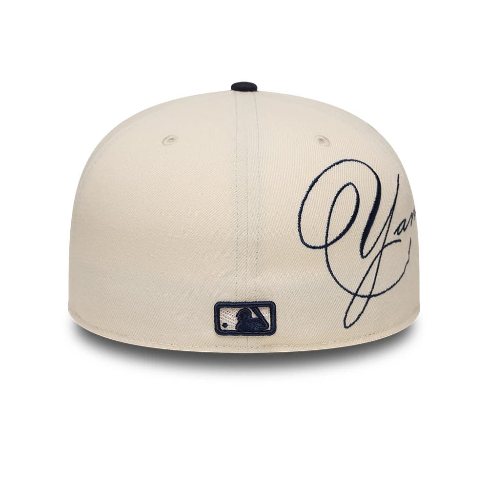Pictured is this MLB Side Script New York Yankees 59FIFTY Fitted cap in Cream. 5