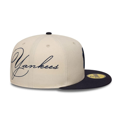 Pictured is this MLB Side Script New York Yankees 59FIFTY Fitted cap in cream & navy. 3