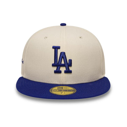 LA Dodgers MLB Side Script Cream & Blue New Era 59FIFTY Fitted Cap, front view showing the raised blue LA logo embroidered on the cream front panels, with a matching blue flat visor and a gold 59FIFTY size sticker on the cap's visor.