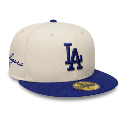 Pictured is this MLB Side Script LA Dodgers 59FIFTY Fitted cap in Cream. 1