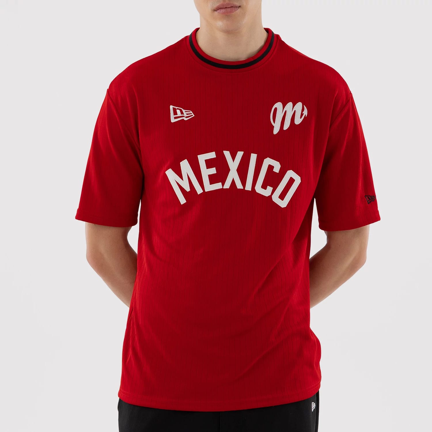 The model is wearing this LMB Mexico Diablos Oversized T-Shirt in red. 5