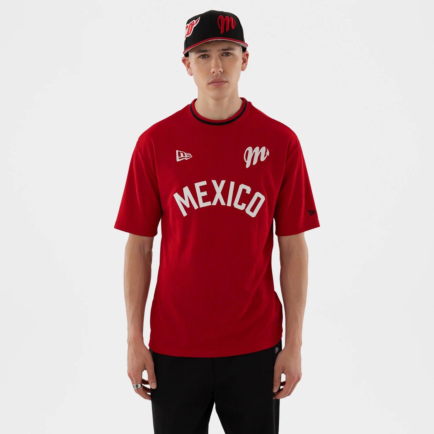 The model is wearing this LMB Mexico Diablos Oversized T-Shirt in red. 1