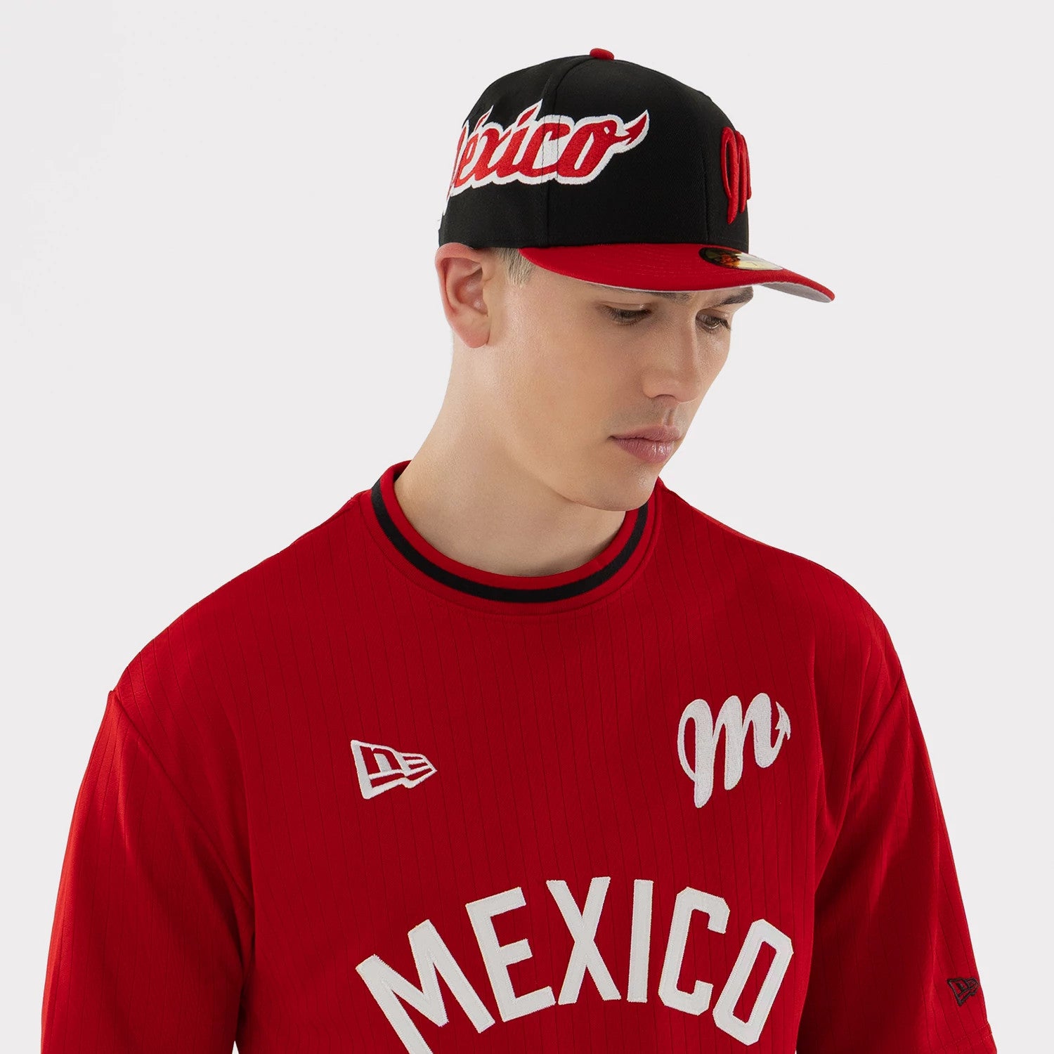 The model is wearing this LMB Mexico Diablos Oversized T-Shirt in red. 3