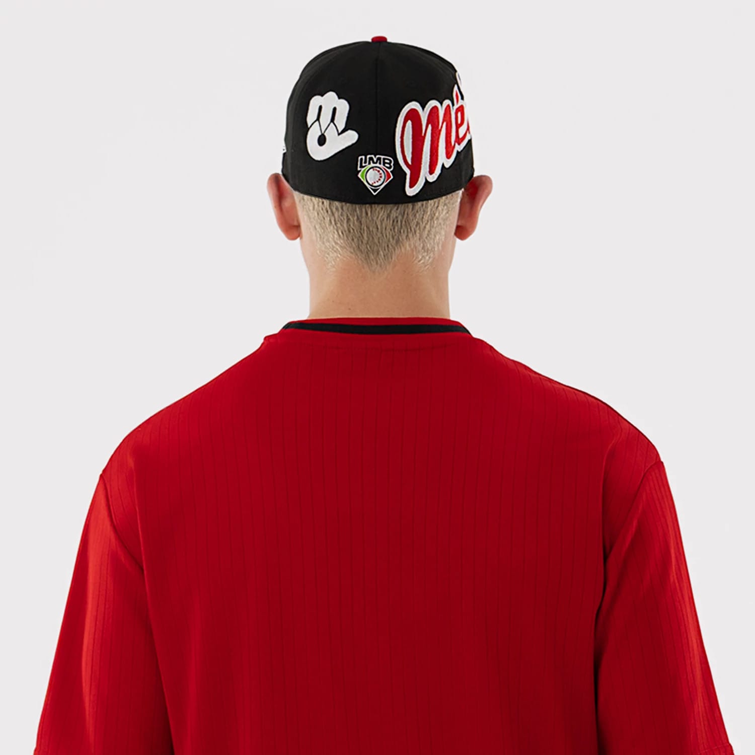 The model is wearing this LMB Mexico Diablos Oversized T-Shirt in red. 7