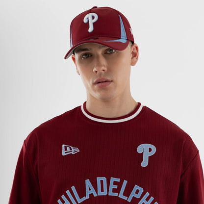 The model is wearing this MLB Philadelphia Phillies Oversized T-Shirt in dark red. 3