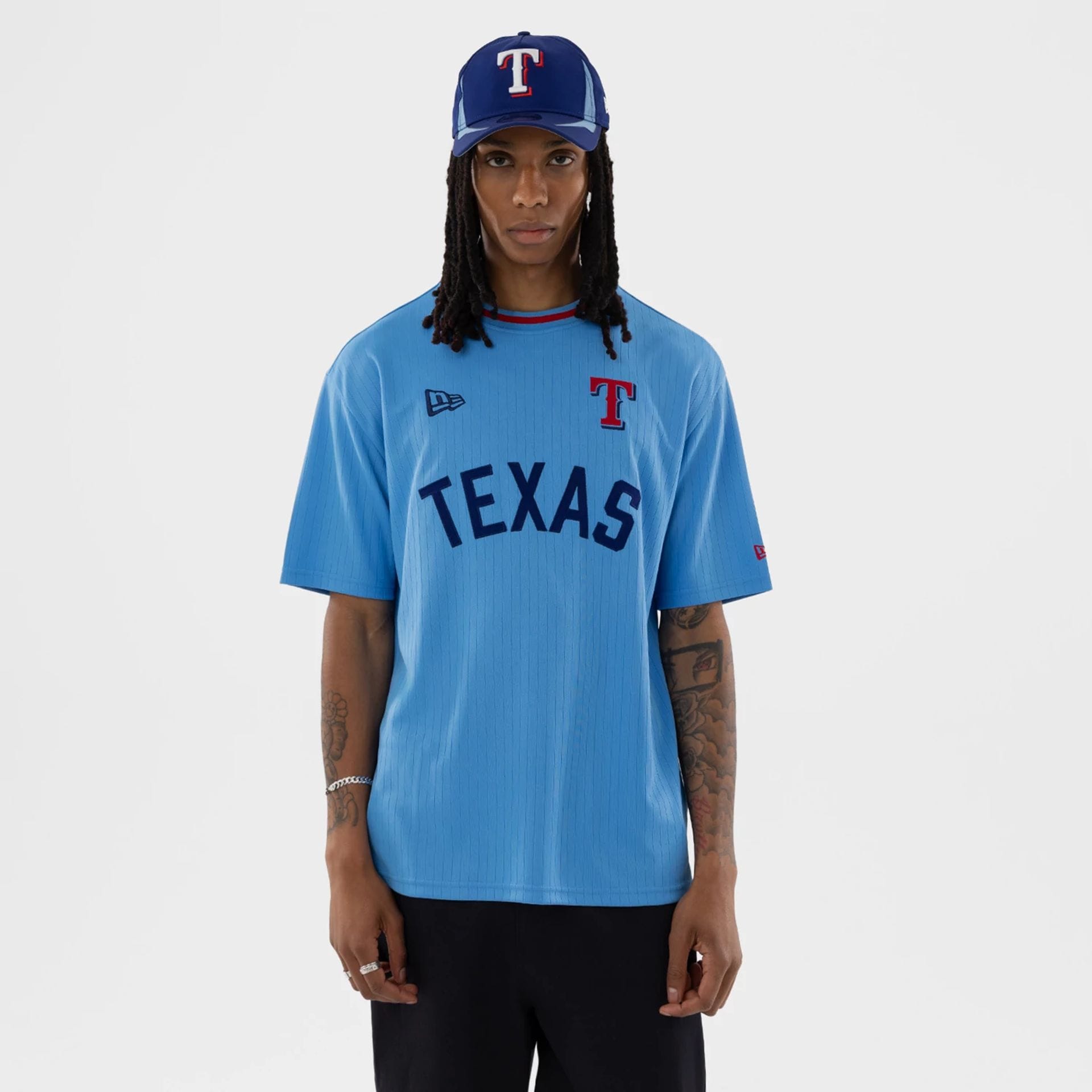 The model is wearing this MLB Texas Rangers T-Shirt in pastel blue. 1