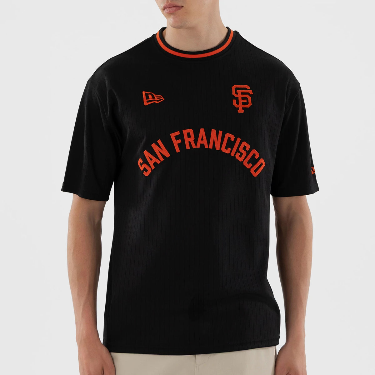 New Era San Francisco Giants MLB Black Oversized T-Shirt, front view showing orange San Francisco lettering across the chest, an embroidered New Era logo on the right shoulder, and an embroidered SF logo on the left chest.