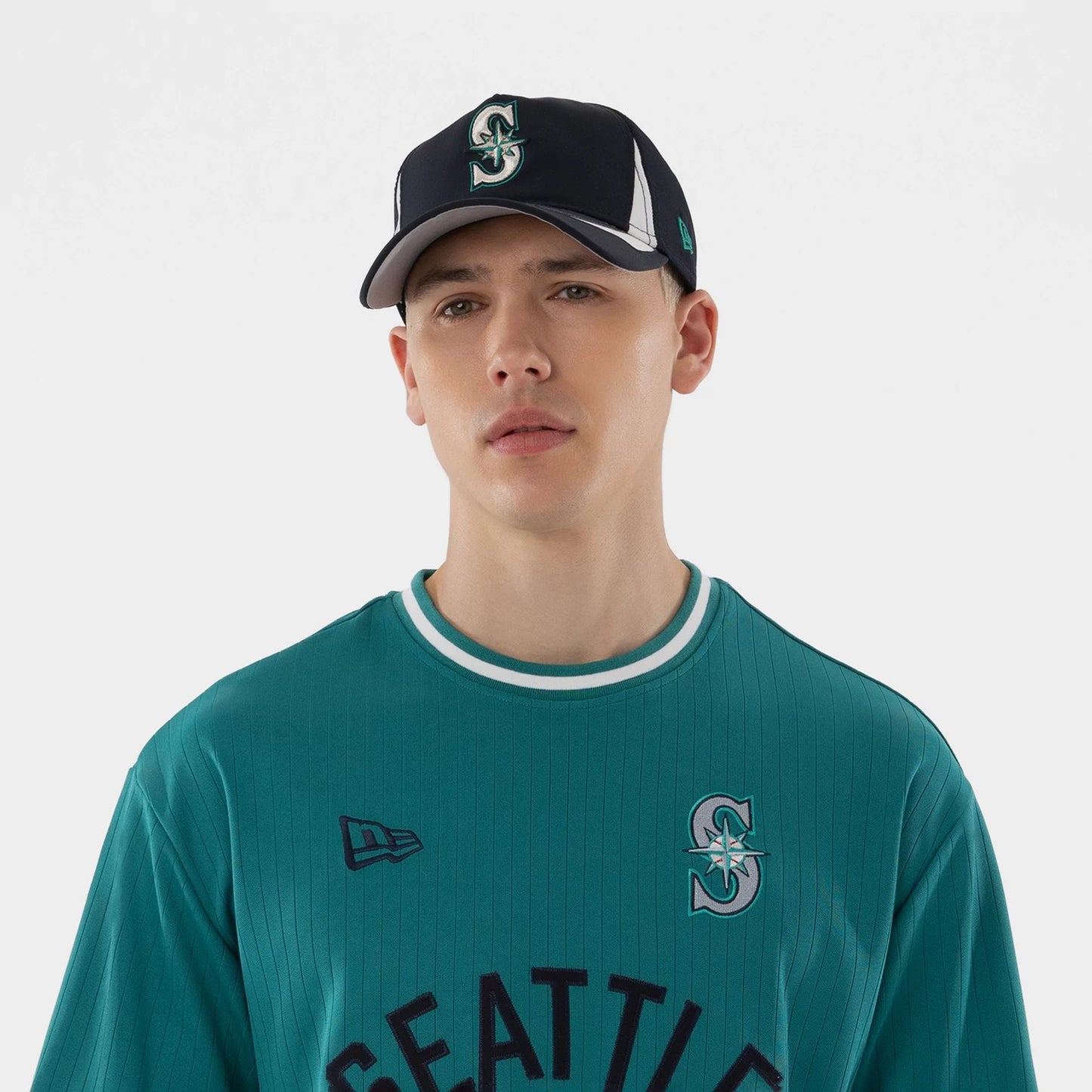 The model is wearing this MLB Seattle Mariners T-Shirt in green. 3