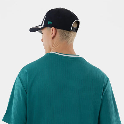 The model is wearing this MLB Seattle Mariners Oversized T-Shirt in green. 7
