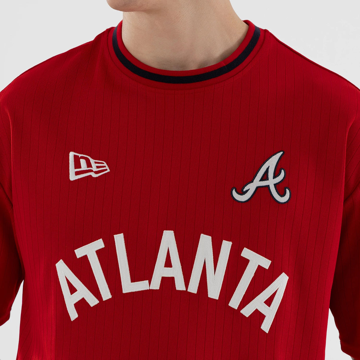 New Era Atlanta Braves MLB Red Oversized T-Shirt, front view featuring white embroidered ATLANTA lettering across the chest, the team’s A logo on the upper right, and an embroidered New Era flag on the upper left, both below the neckline.