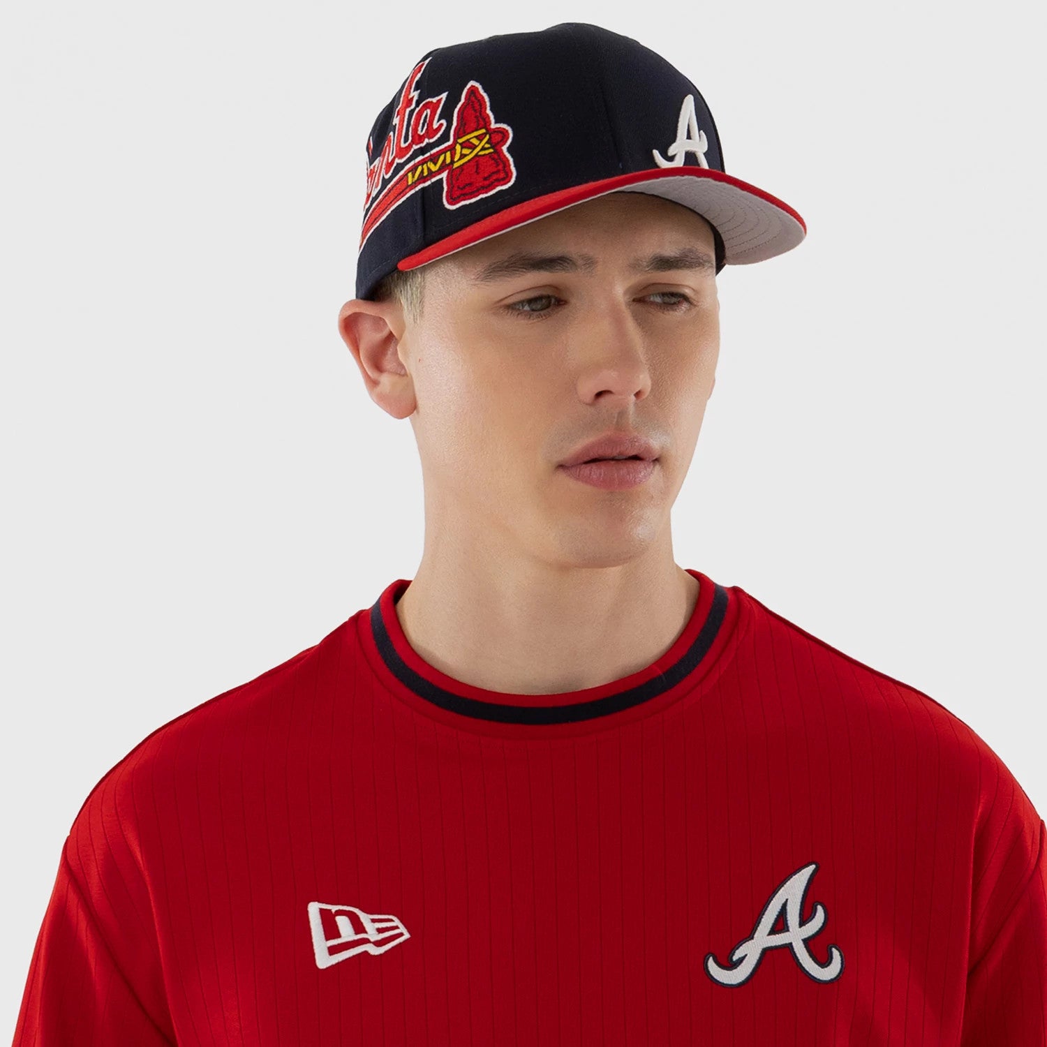The model is wearing this MLB Atlanta Braves Oversized T-Shirt in red. 3