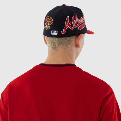The model is wearing this MLB Atlanta Braves Oversized T-Shirt in red. 7