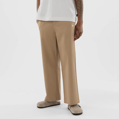 The model is wearing this MLB Athletics Chino Trousers in light beige. 1