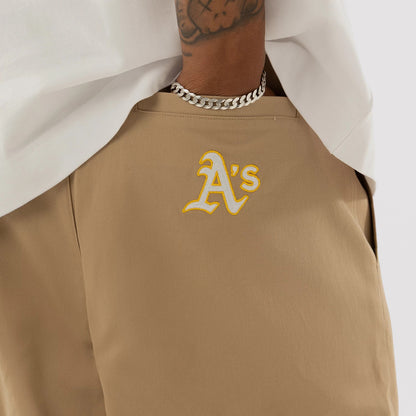 The model is wearing this MLB Athletics Chino Trousers in light beige. 3