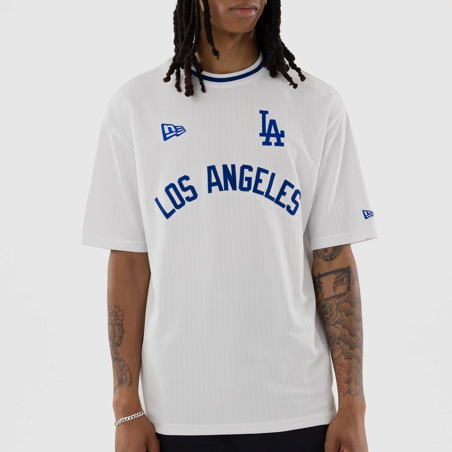 The model is wearing this MLB LA Dodgers T-Shirt in white. 4