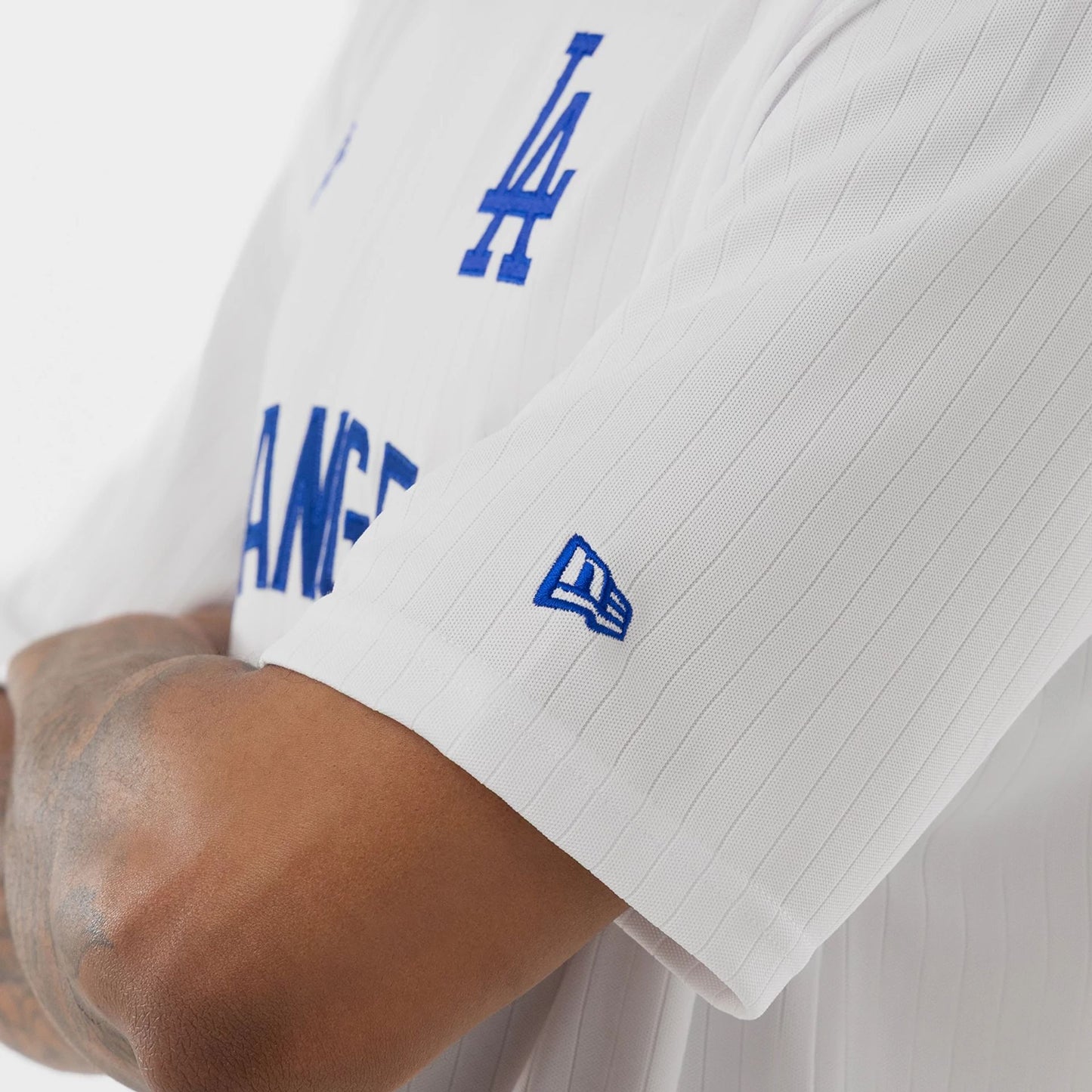 The model is wearing this MLB LA Dodgers T-Shirt in white. 5