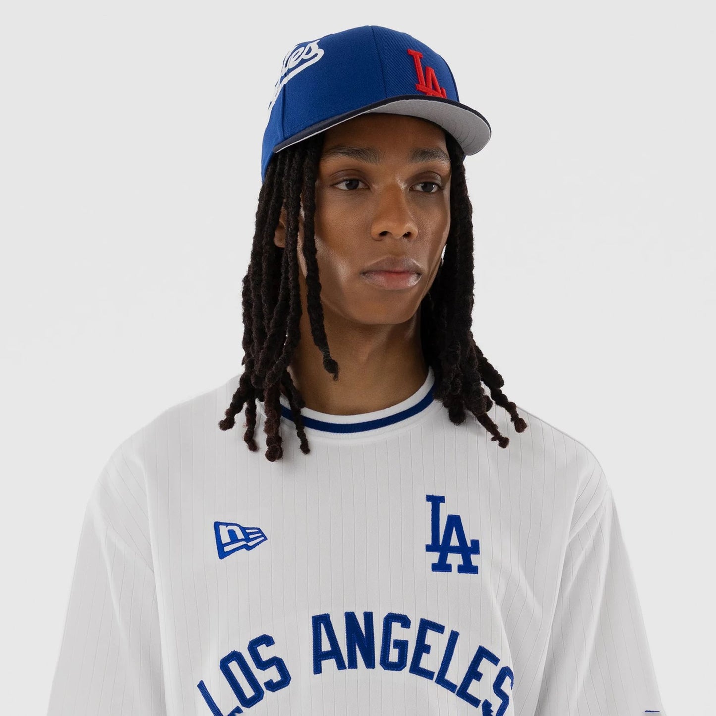 The model is wearing this MLB LA Dodgers T-Shirt in white. 6