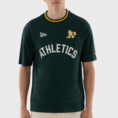 The model is wearing this MLB Athletics Oversized T-Shirt in dark green. 5