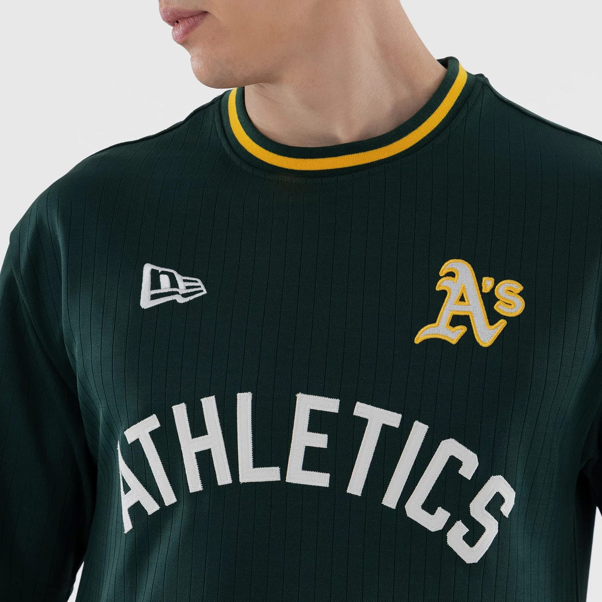 The model is wearing this MLB Athletics Oversized T-Shirt in dark green. 4