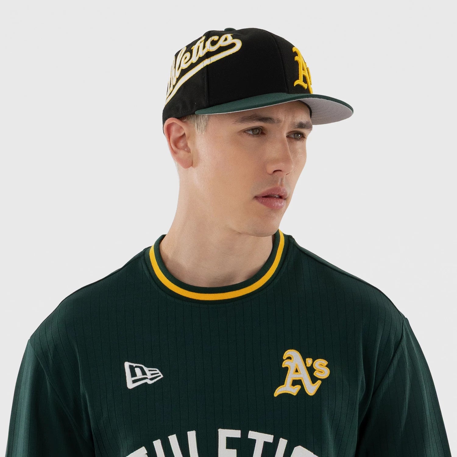 The model is wearing this MLB Athletics Oversized T-Shirt in dark green. 3