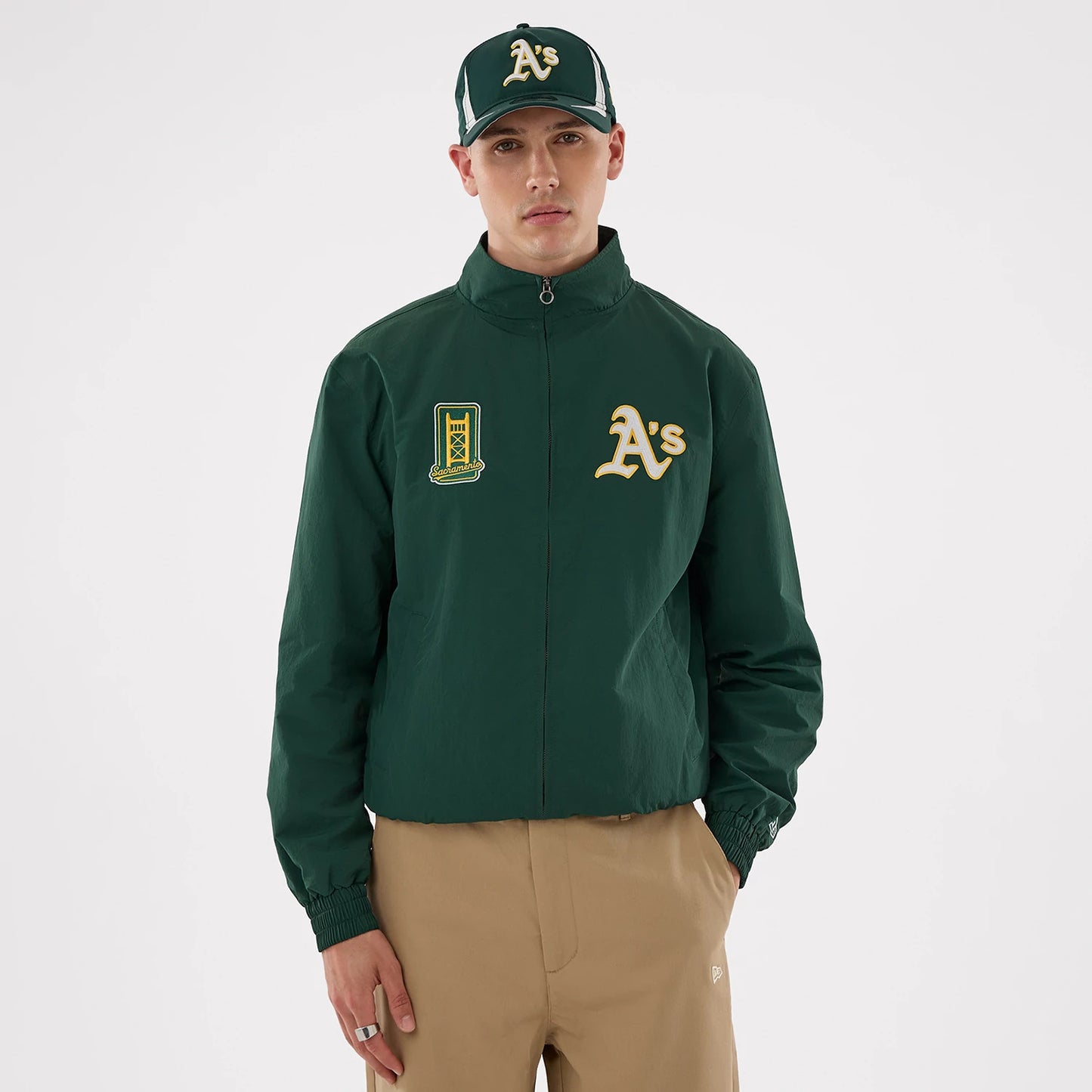 The model is wearing this MLB Athletics Sports Jacket in dark green. 1