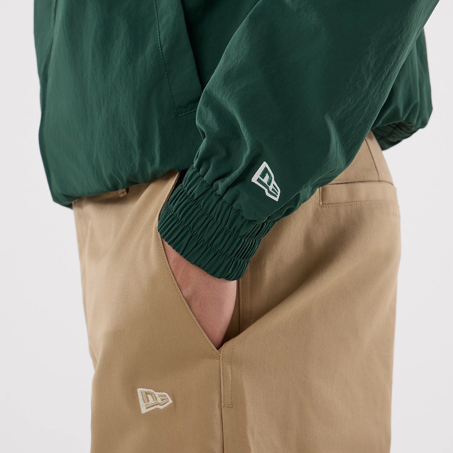 The model is wearing this MLB Athletics Sports Jacket in dark green. 6